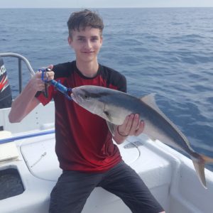 Boy with fish on offshore Bradenton Fishing Charter